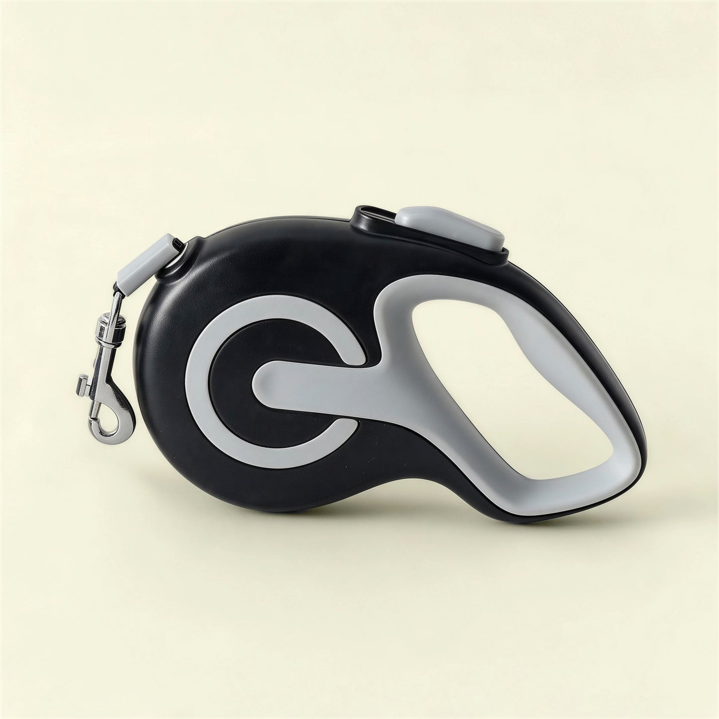 Black colored retractable dog leash shown in a flat lay product photo