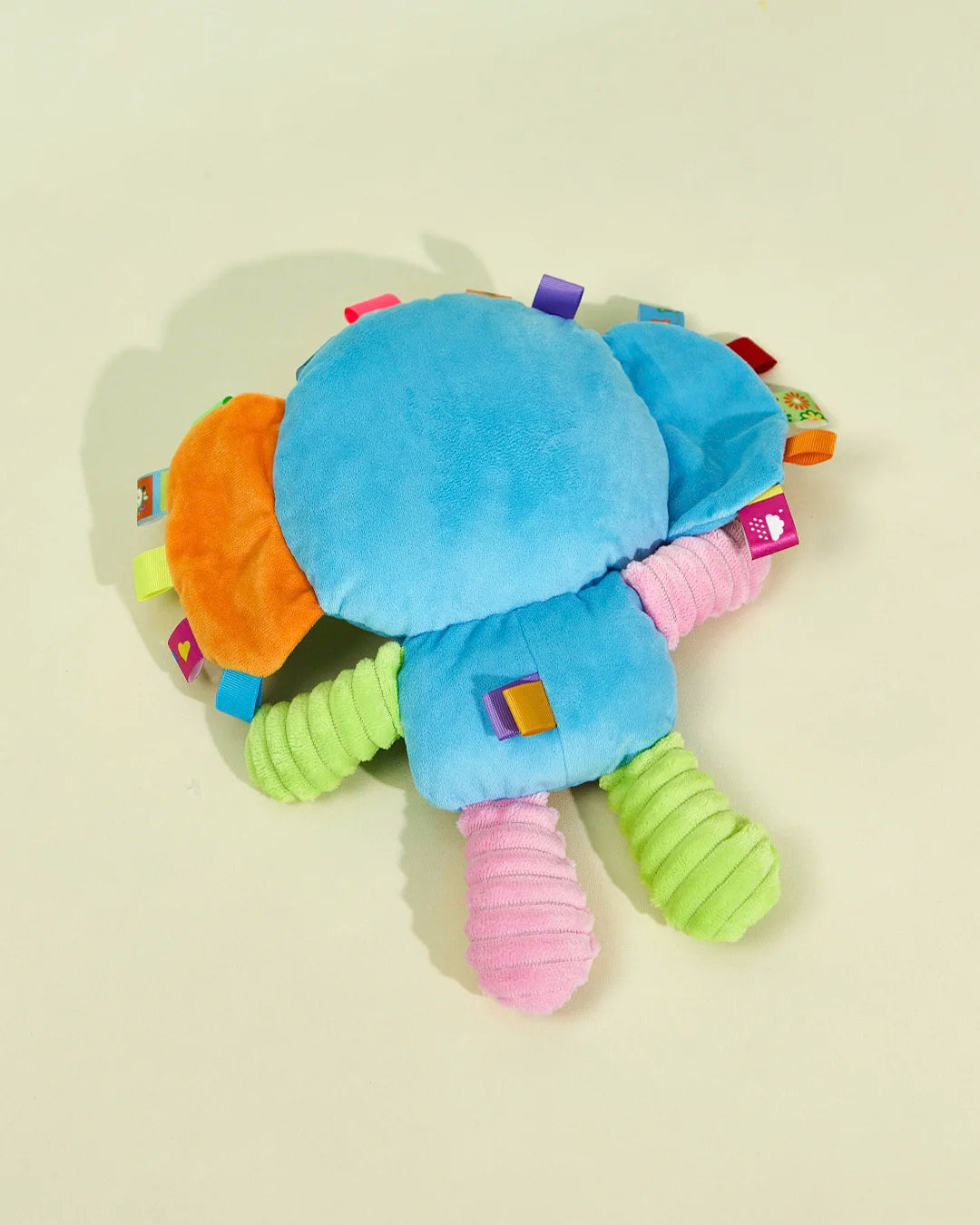 Back view of the blue elephant soft plush interactive dog toy