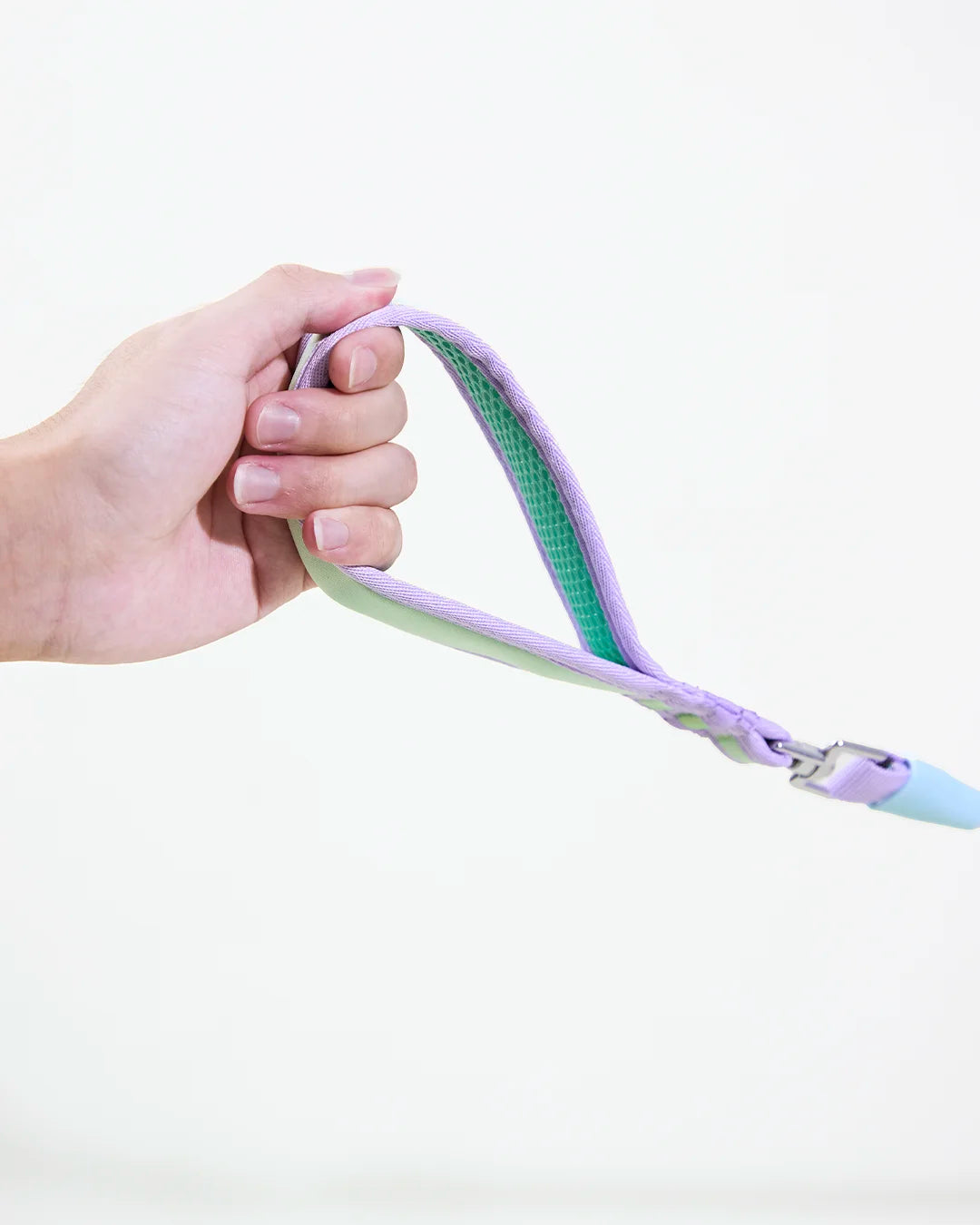 Hand holding CharPaw soft padded dog leash handle for comfortable walking and control