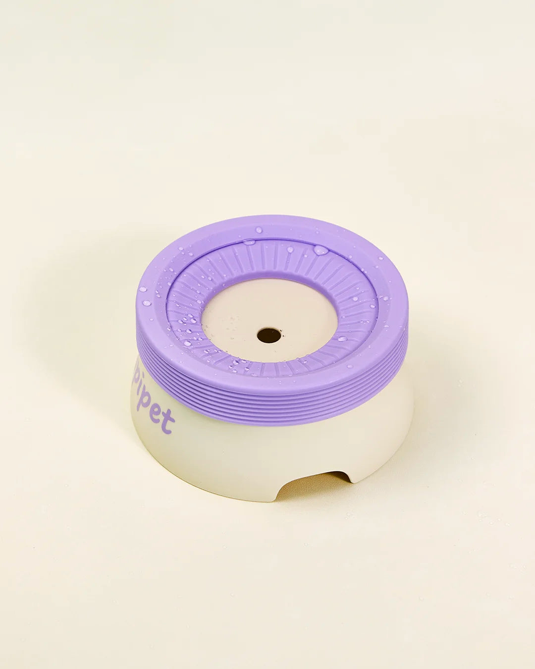 Top view of CharPaw floating disk pet water bowl showing anti-spill design
