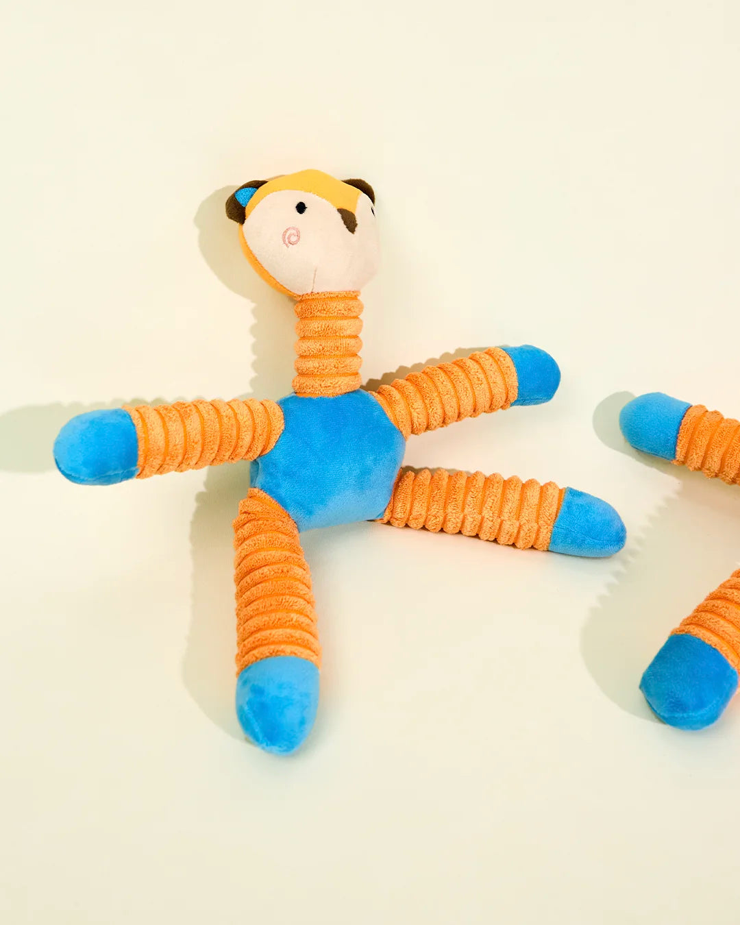 CharPaw colorful plush dog chew toy with multiple squeaky legs for interactive play