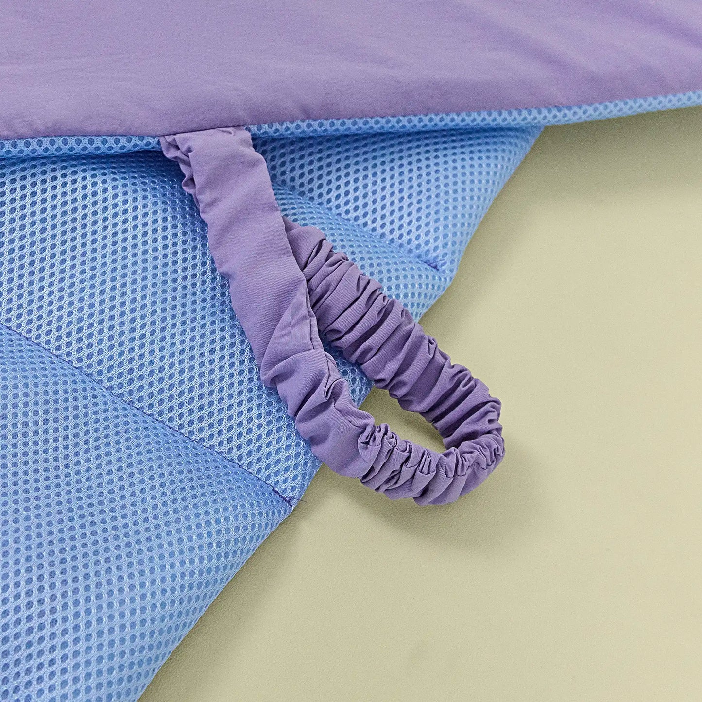 Close-up texture of breathable mesh side on reversible dog mat