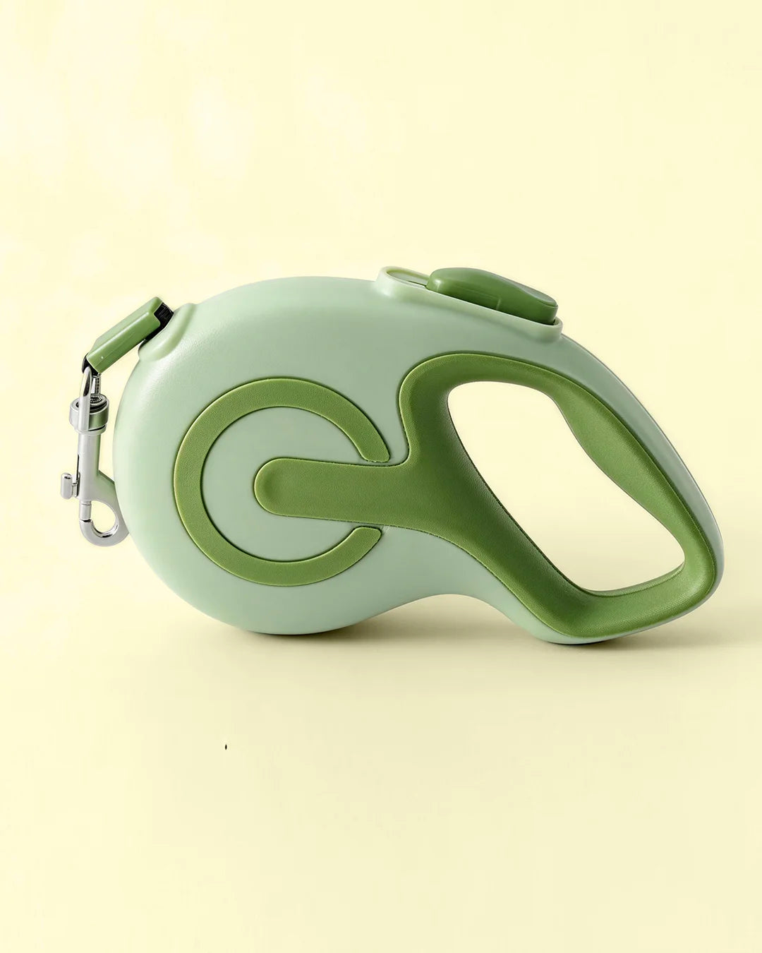 Green colored retractable dog leash shown in a flat lay product photo