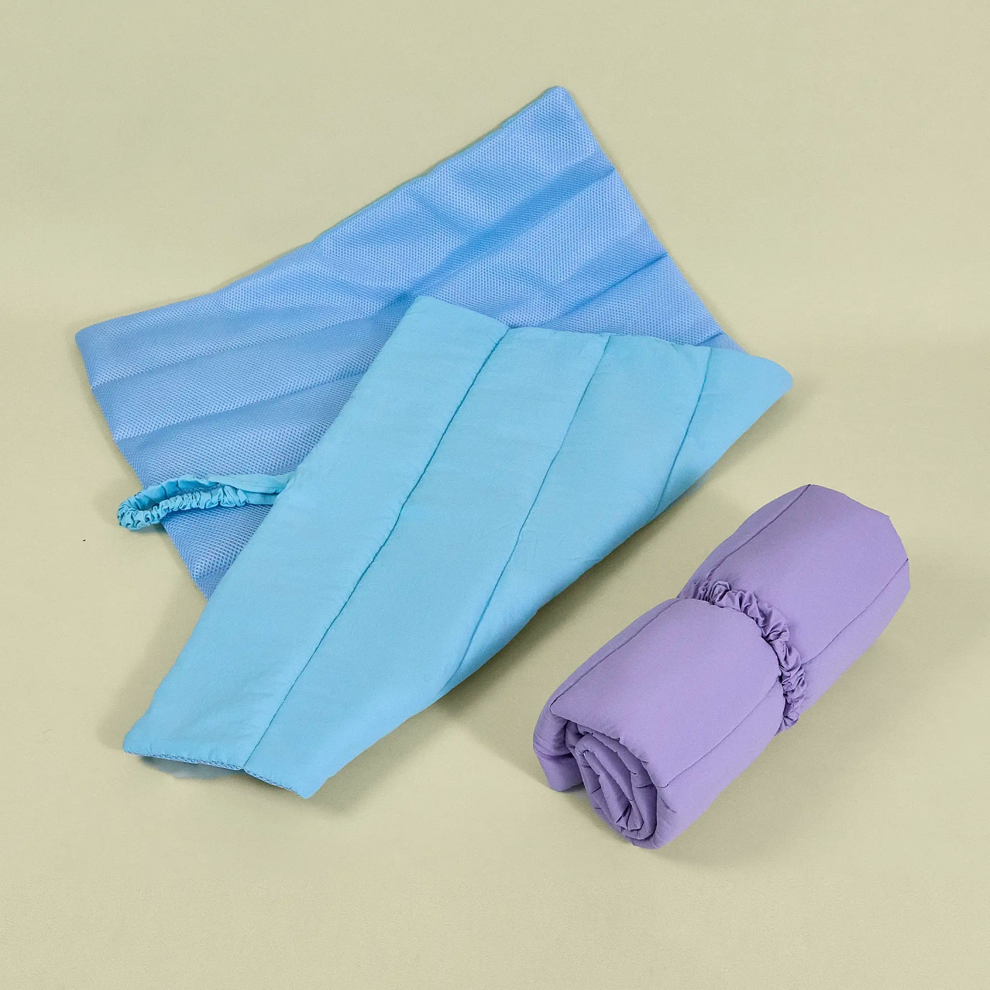 Blue breathable mesh side of reversible dog travel mat folded flat