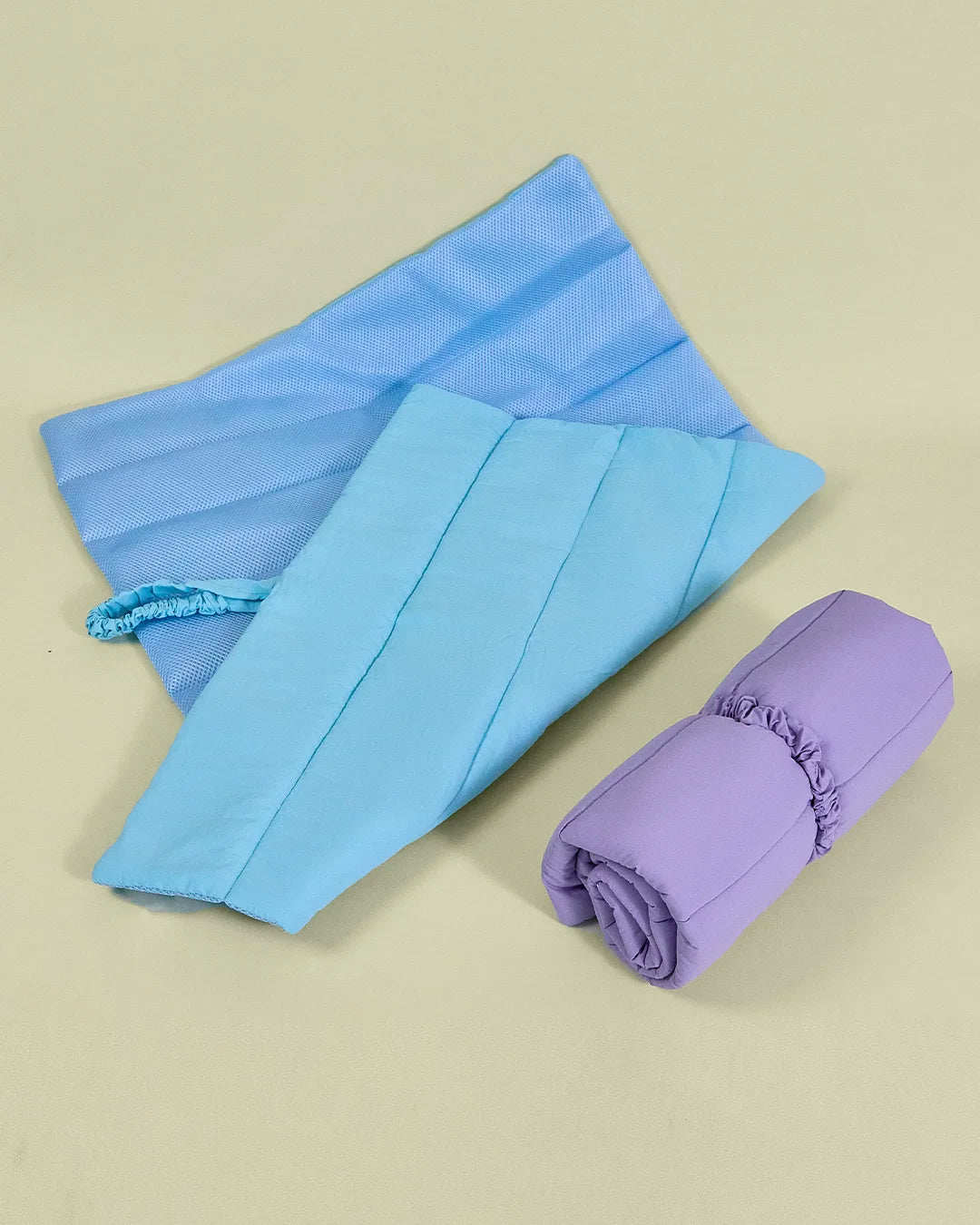 Blue breathable mesh side of reversible dog travel mat folded flat