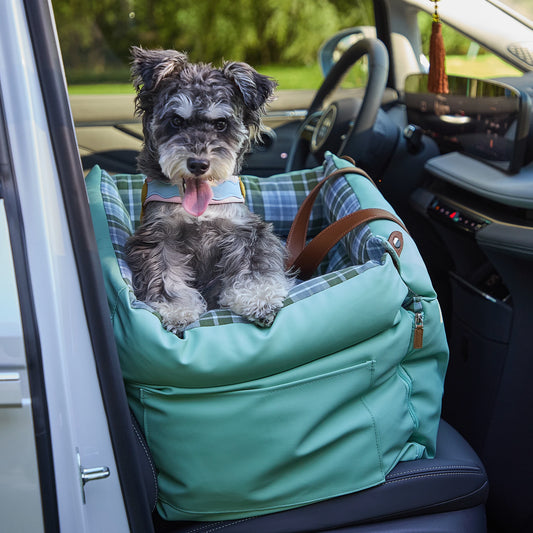 Stylish green plaid dog booster seat made of water-resistant faux leather for family road trips, also comfortable for small cats.