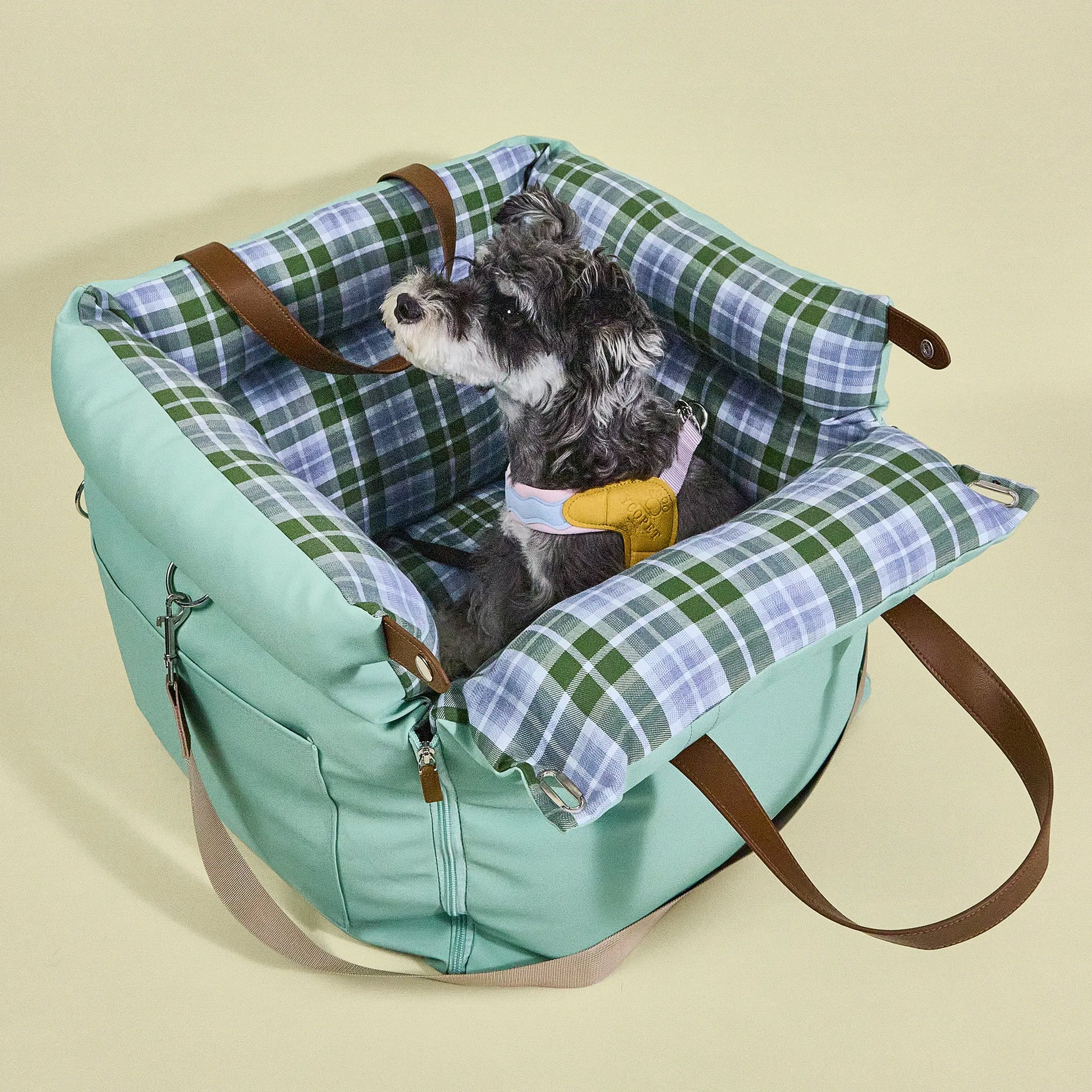 Portable dog travel seat with practical leather handles, bringing a comforting environment for dogs and small pets on family trips.