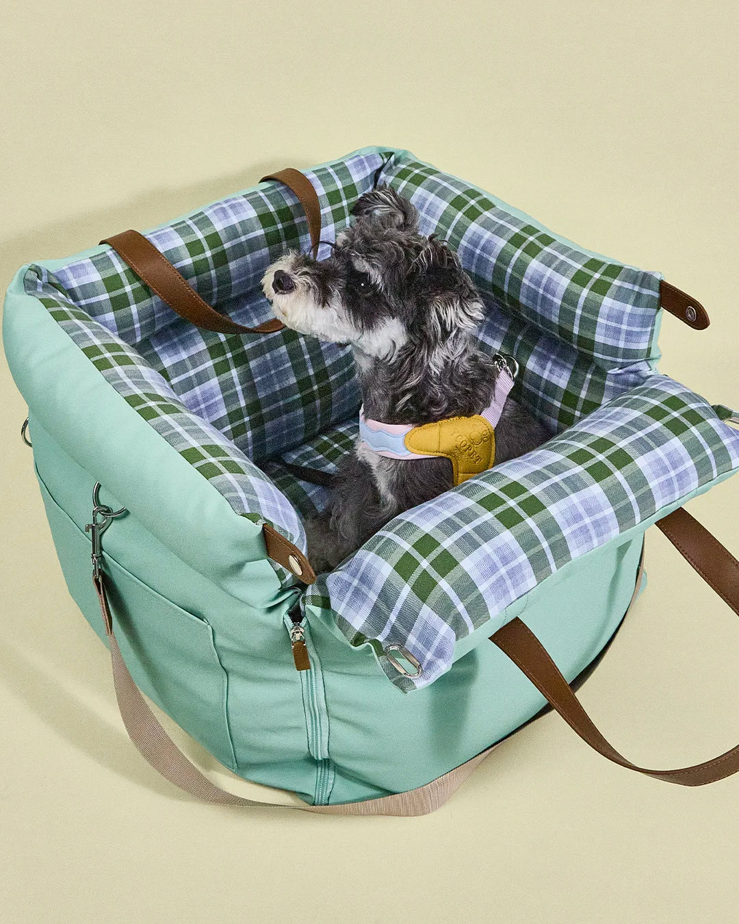 Portable dog travel seat with practical leather handles, bringing a comforting environment for dogs and small pets on family trips.
