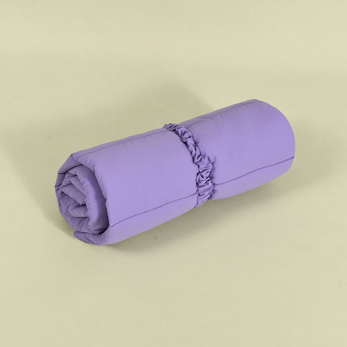 Purple dog travel mat rolled up compactly for easy storage