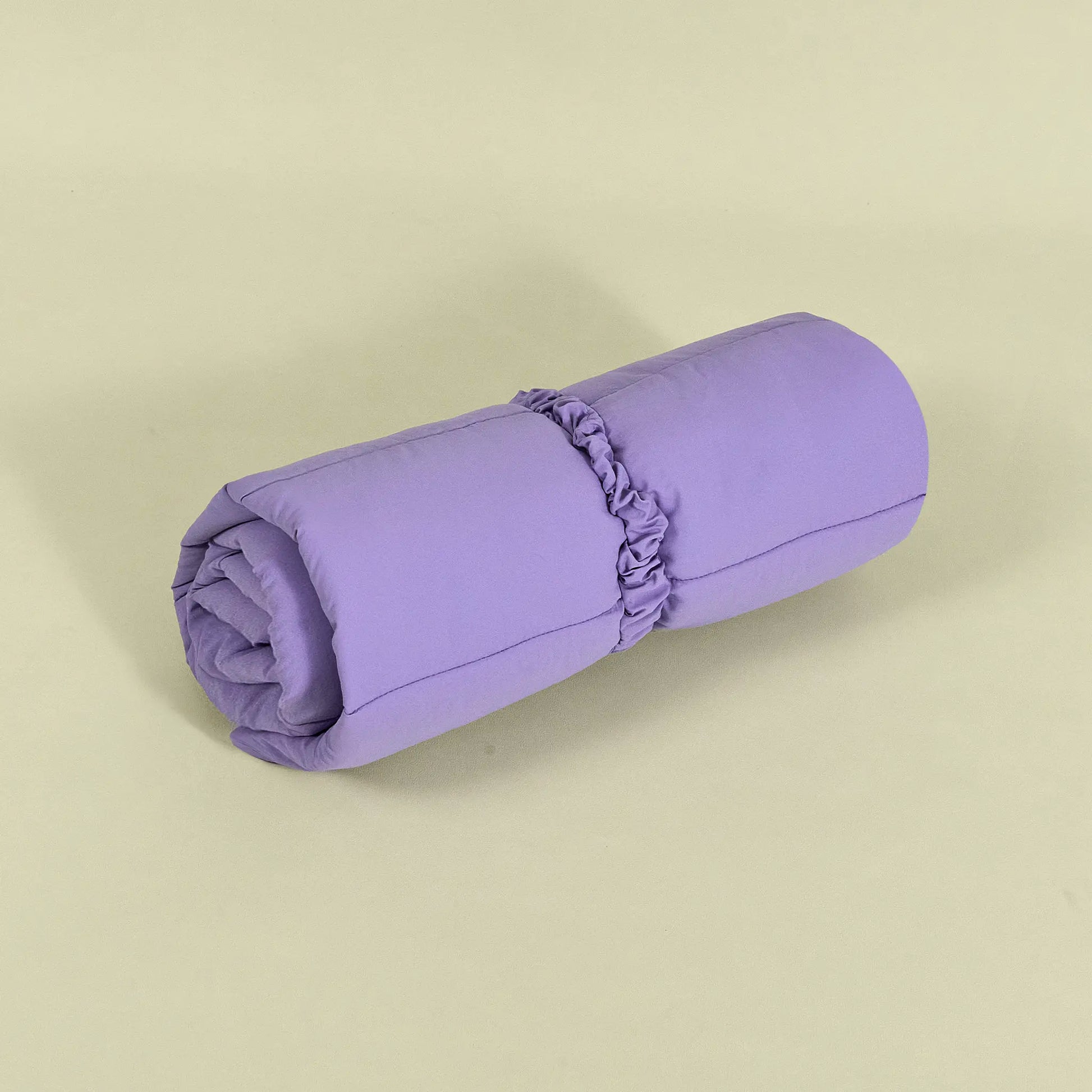 Purple dog travel mat rolled up compactly for easy storage