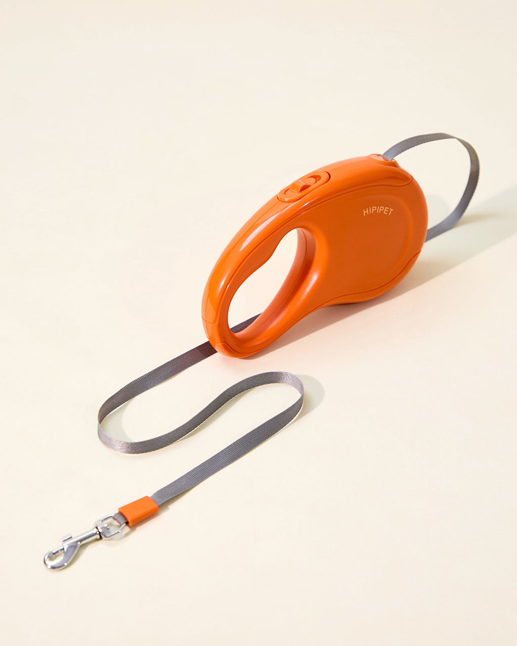 Sunset orange retractable dog leash with swivel clip